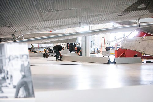 MIKAELA MACKENZIE / WINNIPEG FREE PRESS

Jay Ross (left) and David Doole with Kubik put together the guard rails at the new Royal Aviation Museum of Western Canada in Winnipeg on Wednesday, May 11, 2022. For Al Small story.
Winnipeg Free Press 2022.