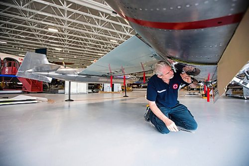 MIKAELA MACKENZIE / WINNIPEG FREE PRESS

Steve Pajot, owner the CF-104 Starfighter, opens up the hydraulics bay of the jet to get the pitot boom out at the new Royal Aviation Museum of Western Canada in Winnipeg on Wednesday, May 11, 2022. For Al Small story.
Winnipeg Free Press 2022.