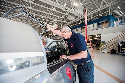 MIKAELA MACKENZIE / WINNIPEG FREE PRESS

Steve Pajot, owner the CF-104 Starfighter, opens up the jet simulator at the new Royal Aviation Museum of Western Canada in Winnipeg on Wednesday, May 11, 2022. For Al Small story.
Winnipeg Free Press 2022.