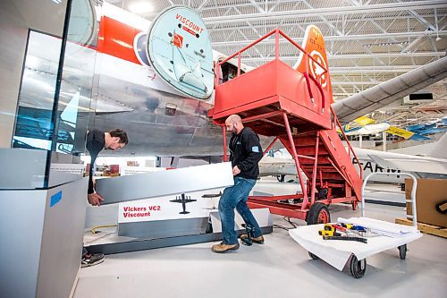 MIKAELA MACKENZIE / WINNIPEG FREE PRESS

Jay Ross (left) and David Doole with Kubik put together the guard rails at the new Royal Aviation Museum of Western Canada in Winnipeg on Wednesday, May 11, 2022. For Al Small story.
Winnipeg Free Press 2022.