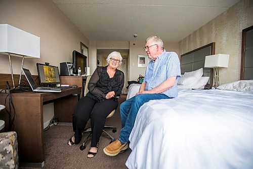 MIKAELA MACKENZIE / WINNIPEG FREE PRESS

Christa Ferreira and her husband, Jones, pose for a portrait in their Holiday Inn room in Winnipeg on Thursday, May 12, 2022. They left their home near St. Adolphe on April 30, after being given a voluntary evacuation notice due to flooded roads, and they've been bouncing around hotels since then. For Chris Kitching story.
Winnipeg Free Press 2022.