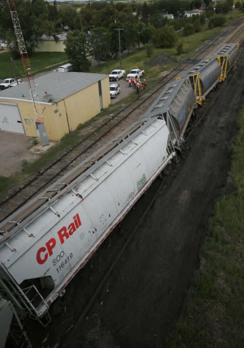 Brandon Sun Train cars zig-zag across the track in the main CP Rail yard after coming off the tracks under the Eighth Street bridge on Tuesday afternoon. (Bruce Bumstead/Brandon Sun)