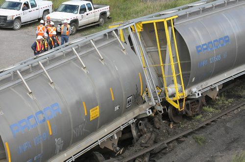 Brandon Sun Train cars zig-zag across the tracks as safety officially survey the damage in the main CP Rail yard after coming off the tracks under the Eighth Street bridge on Tuesday afternoon. (Bruce Bumstead/Brandon Sun)