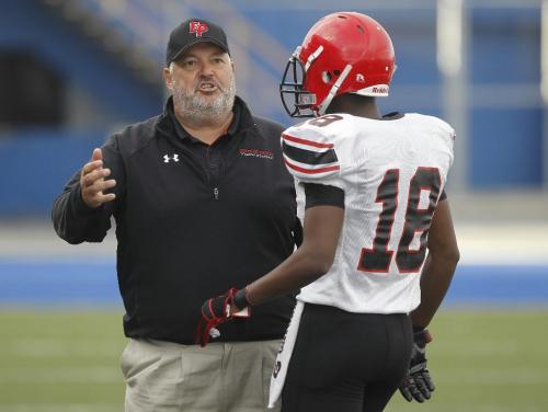 TREVOR HAGAN / WINNIPEG FREE PRESS - Eden Prairie Head Coach Mike Grant gives instructions as his team faces off agains the Oak Park Raiders during the 2010 Can Am Challenge at CanadInns Stadium. 10-09-03