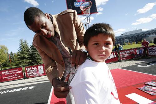 September 18, 2010 - 100918  - NBA player Thaddeus Young of the Philadelphia 76ers signs an autograph for young fan Walter Pereira (8) during NBA Jam Session in Winnipeg Saturday, September 18, 2010.    John Woods / Winnipeg Free Press