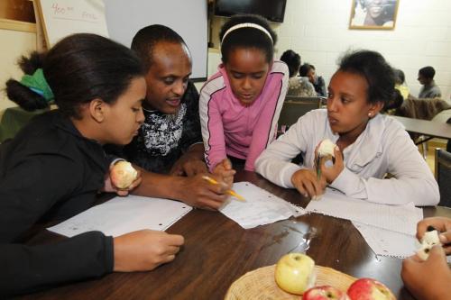 BORIS.MINKEVICH@FREEPRESS.MB.CA  100921 BORIS MINKEVICH / WINNIPEG FREE PRESS After school program for African kids. L-R  Simret Hanson, Mehari Negussie (tutor), Niat Mahary, and Amina Omer.