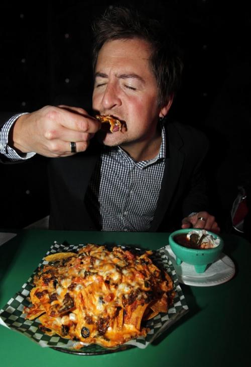 BORIS.MINKEVICH@FREEPRESS.MB.CA  100922 BORIS MINKEVICH / WINNIPEG FREE PRESS International Day of the Nacho. Nachos at Don Padro's. Jay Oliver from CLEAR-FM poses for a photo.