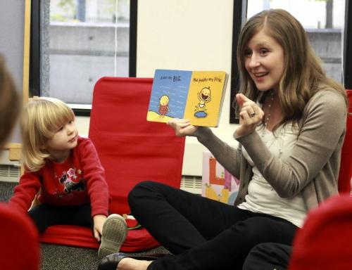 MIKE.DEAL@FREEPRESS.MB.CA 100923 - Thursday, September 23, 2010 -  A preschool reading class at the Millennium Library. Lindsay Schluter reads books to some moms with their babies at the Millennium Library. MIKE DEAL / WINNIPEG FREE PRESS