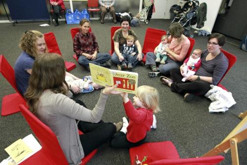 MIKE.DEAL@FREEPRESS.MB.CA 100923 - Thursday, September 23, 2010 -  A preschool reading class at the Millennium Library. Lindsay Schluter reads books to some moms with their babies at the Millennium Library. MIKE DEAL / WINNIPEG FREE PRESS