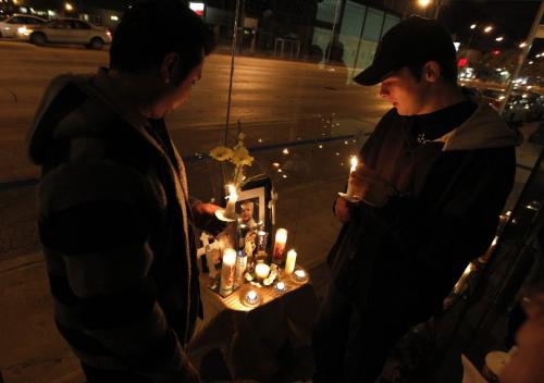 BORIS.MINKEVICH@FREEPRESS.MB.CA  100928 BORIS MINKEVICH / WINNIPEG FREE PRESS A vigil in the memory of murder victim Darren Walsh at the corner of Euclid St. Avenue and Main Street. Cousin of murder victim Matthew Mohamed and brother of victim Trevor Walsh in the bus shack.