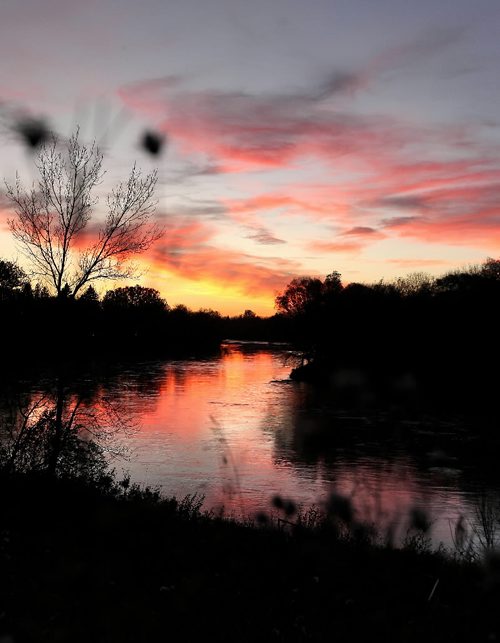 Ruth Bonneville Winnipeg Free Press Local Standup - A mirror image of a red and pink sky is reflected on the  Assiniboine River Wednesday evening after another beautiful autumn day in Manitoba.