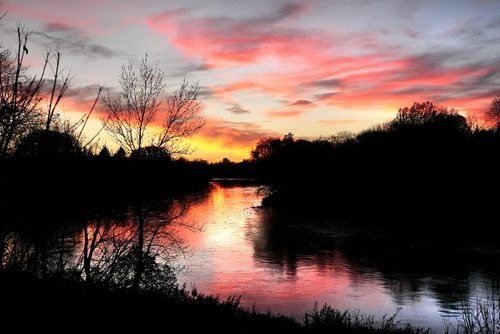 Ruth Bonneville Winnipeg Free Press Local Standup - A mirror image of a red and pink sky is reflected on the  Assiniboine River Wednesday evening after another beautiful autumn day in Manitoba.