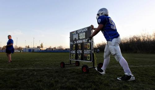 Ruth Bonneville / Winnipeg Free Press Sports - Oak Park Raider #53 Alex Loch pushes the score keeper off his home field after winning the game against the Kelvin Clippers Thursday night.