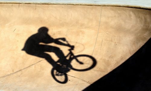 Brandon Sun A BMX cyclist takes to the air while riding in one of the bowls at the Kristopher Campbell Memorial Skateboard Plaza, which is still under construction, on Sunday afternoon. Gates to the site were accidentally left open on Friday and skateboards and cyclist have taken advantage of the newly set surfaces. Painting and a final inspection needs to take place before the plaza is officially opened to the public. (Bruce Bumstead/Brandon Sun)