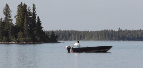 JOE.BRYKSA@FREEPRESS.MB.CA NO RUNNING WATER FEATURE-(See Helen's story)   A First Nation fisherman fishes on Island Lake near Garden Hill First Nation- July 2010, - JOE BRYKSA/WINNIPEG FREE PRESS