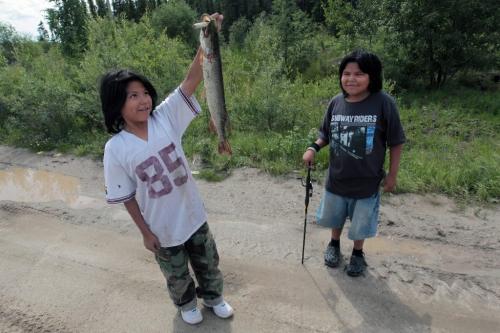 JOE.BRYKSA@FREEPRESS.MB.CA NO RUNNING WATER FEATURE-(See Helen's story)  -    Youngsters show off jackfish they caught at Red Sucker Lake First Nation. - July  2010, - JOE BRYKSA/WINNIPEG FREE PRESS