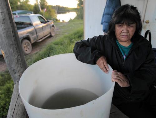 JOE.BRYKSA@FREEPRESS.MB.CA NO RUNNING WATER FEATURE-(See Helen's story)  -    Annie Dan  stores lake water  in a container  for  use at her  Red Sucker Lake First Nation home- July , 2010, - JOE BRYKSA/WINNIPEG FREE PRESS