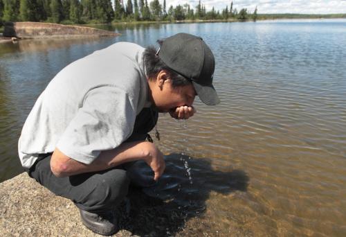 JOE.BRYKSA@FREEPRESS.MB.CA NO RUNNING WATER FEATURE-(See Helen's story)   Sam Wood  from  Wasagamack First Nation  takes a drink from traditional lake called Kalicahoolie north of his reservation. This is traditional hunting and fishing area for the First Nation- July 2010, - JOE BRYKSA/WINNIPEG FREE PRESS