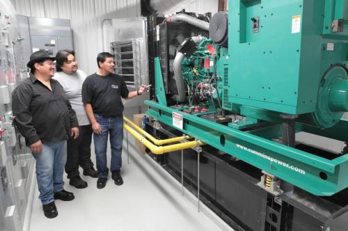 JOE.BRYKSA@FREEPRESS.MB.CA NO RUNNING WATER FEATURE-(See Helen's story)    Fisher River Cree Nation- l to R  Herb Bradburn, Dave Cochrane and Willy Choken look at backup generator  during tour of  new state-of-the-art water treatment plant on reserve  - JOE BRYKSA/WINNIPEG FREE PRESS
