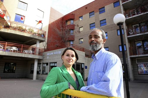 MIKE.DEAL@FREEPRESS.MB.CA 101015 - Friday, October 15, 2010 -  Dorota Blumczynska executive director for the Immigrant and Refugee Community Organization of Manitoba with Yohannes Yemane a new immigrant from Eritrea outside the IRCOM building on Ellen Street. MIKE DEAL / WINNIPEG FREE PRESS