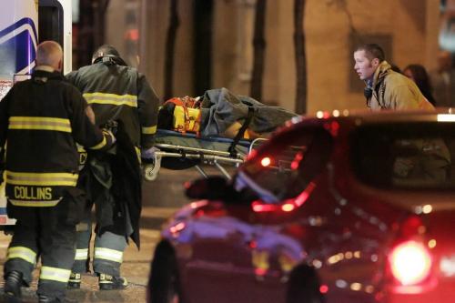 A pedestrian is rushed into a waiting ambulance after being hit by a car which was traveling east bound on Portage Avenue at Donald in downtown Winnipeg Saturday, October 16, 2010.    Winnipeg Free Press/John Woods
