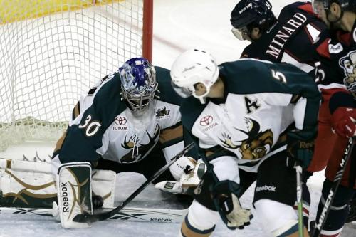 Manitoba Moose goalie Tyler Weiman (30) robs Grand Rapids Griffens Chris Minard (14) of the goal during the second period of their AHL game in Winnipeg Saturday, October 16, 2010.    Winnipeg Free Press/John Woods
