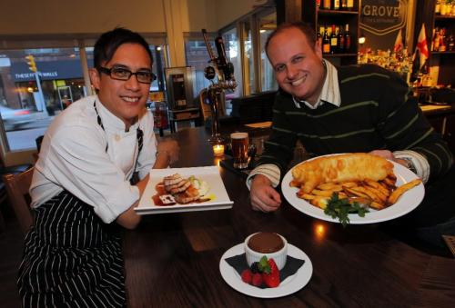 BORIS.MINKEVICH@FREEPRESS.MB.CA  101020 BORIS MINKEVICH / WINNIPEG FREE PRESS The Grove Pub & Restaurant. Exec. Chef Norman Pastorin and owner Miles Gould pose for a photo with some food. l-r Pork Belly, Sticky Toffee Pudding, Fish and Chips.