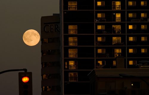 DAVID LIPNOWSKI / WINNIPEG FREE PRESS (October 22, 2010) A full moon over downtown Winnipeg Friday afternoon.
