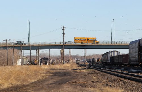 Brandon Sun 03112010 A school bus heads north over the 1st St. bridge in Brandon on Wednesday. (Tim Smith/Brandon Sun)