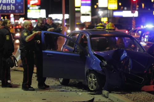 BORIS.MINKEVICH@FREEPRESS.MB.CA   BORIS MINKEVICH / WINNIPEG FREE PRESS 101103 Car crash on McPhillips and Inkster. The woman went to hospital RED. Stolen car unit on scene as well.