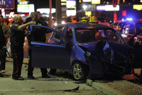 BORIS.MINKEVICH@FREEPRESS.MB.CA   BORIS MINKEVICH / WINNIPEG FREE PRESS 101103 Car crash on McPhillips and Inkster. The woman went to hospital RED. Stolen car unit on scene as well.