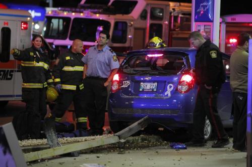 BORIS.MINKEVICH@FREEPRESS.MB.CA   BORIS MINKEVICH / WINNIPEG FREE PRESS 101103 Car crash on McPhillips and Inkster. The woman went to hospital RED. Stolen car unit on scene as well.