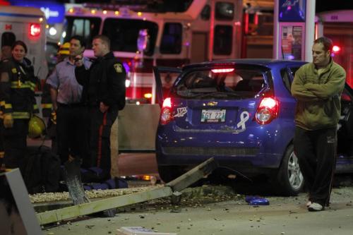 BORIS.MINKEVICH@FREEPRESS.MB.CA   BORIS MINKEVICH / WINNIPEG FREE PRESS 101103 Car crash on McPhillips and Inkster. The woman went to hospital RED. Stolen car unit on scene as well.