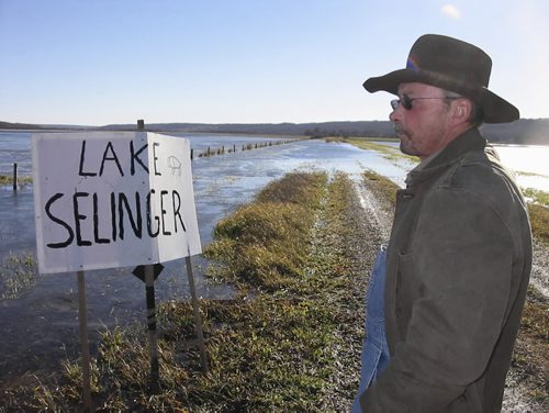 Winnipeg - First four photos, 08, 20,21, 26 are of mixed farmer Gene Nerbas in front of fields flooded by the Shellmouth Dam, where someone has placed a Lake Selinger sign. Last two photos, 027 and 033, are of cattle rancher Cliff Trinder in front of the control gate of the Shellmouth Dam. Bill Redekop photos. November 4 2010.