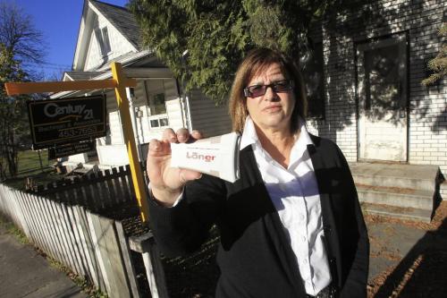MIKE.DEAL@FREEPRESS.MB.CA 101105 - Friday, November 05, 2010 -  Real-estate consultant Roberta Weiss holds up a panic button device that Rogers is now selling to people who work alone on the road. See Geoff Kirbyson story MIKE DEAL / WINNIPEG FREE PRESS