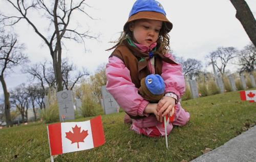 MIKE.DEAL@FREEPRESS.MB.CA 101106 - Saturday, November 06, 2010 -  Holly Compeau-Lough, 5, along with other Winnipeg area Scouts, Cubs and Beavers were at Brookside Cemetery planting flags in preparation for Remembrance Day next week. MIKE DEAL / WINNIPEG FREE PRESS
