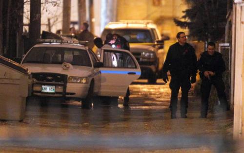 BORIS.MINKEVICH@FREEPRESS.MB.CA   BORIS MINKEVICH / WINNIPEG FREE PRESS 101110 Police arrest people in the back lane of Young near the U of W. May or may not be part of a shooting scene. Someone was shot, not confirmed, in the chest.