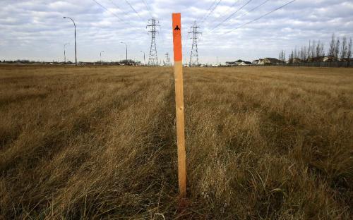 MIKE.DEAL@FREEPRESS.MB.CA 101112 - Friday, November 12, 2010 -  A series of Manitoba Hydro stakes are all that can be seen of the construction of a multi-use path along Lagimodiere close to Fermor. See Bartley Kives story. MIKE DEAL / WINNIPEG FREE PRESS