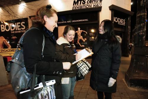 November 12, 2010 - 101112  -  Ashleigh Meyer (R) and Paulina Parada sign a petition for Judith Cheung outside Bodies: The Exhibition exhibit Friday November 12, 2010. The petition is close down the controversial exhibit amidst ethical concerns.  John Woods / Winnipeg Free Press