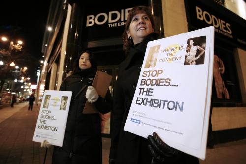November 12, 2010 - 101112  - Judith Cheung (L), and Cathy Rocke stand outside Bodies: The Exhibition exhibit with a petition to close down the controversial exhibit amidst ethical concerns  Friday November 12, 2010.  John Woods / Winnipeg Free Press