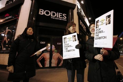 November 12, 2010 - 101112  -  Judith Cheung (L), Cathy Rocke (C), and Maria Cheung stand outside Bodies: The Exhibition exhibit with a petition to close down the controversial exhibit amidst ethical concerns  Friday November 12, 2010.  John Woods / Winnipeg Free Press