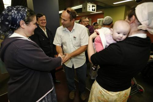 November 12, 2010 - 101112  - Jason Steiner greets his sister-in-law Joanna Wall and his young niece Emily (4mth) at the Winnipeg airport Friday November 12, 2010 as he and his family returned home after being stuck in Bolivia with visa complications. John Woods / Winnipeg Free Press