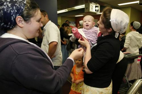 November 12, 2010 - 101112  - Trudy Steiner greets her sister-in-law Joanna Wall (L) and holds her young niece Emily (4mth) at the Winnipeg airport Friday November 12, 2010 as Steiner and her family returned home after being stuck in Bolivia with visa complications. John Woods / Winnipeg Free Press