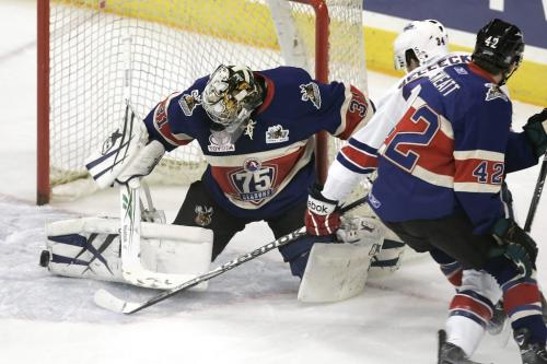 November 12, 2010 - 101112  - Manitoba Moose goalie Eddie Lack (31) saves the shot of the stick of Rochester Americans  Eric Selleck (34) in the first period of their AHL game in Winnipeg  Friday November 12, 2010.  John Woods / Winnipeg Free Press