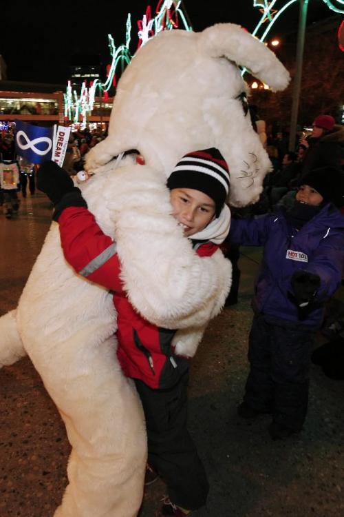 November 13, 2010 - 101113  - Cole Morriseau gets a hug from mascot at the Jaycees Powersmart Santa Claus Parade on Portage Avenue Saturday November 13, 2010.  John Woods / Winnipeg Free Press
