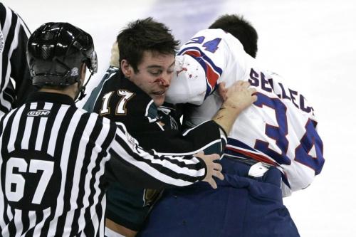 November 13, 2010 - 101113  - Manitoba Moose Aaron Volpatti (17) and Rochester Americans  Eric Selleck (34) go at it in the second period of their AHL game in Winnipeg  Saturday November 13, 2010.  John Woods / Winnipeg Free Press