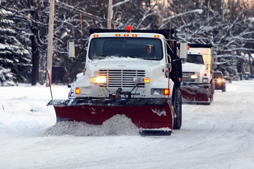 BORIS.MINKEVICH@FREEPRESS.MB.CA   BORIS MINKEVICH / WINNIPEG FREE PRESS 101121 Snow plows clear St. Vital road Sunday afternoon after Winnipeg was hit with a dump of the white stuff.