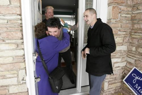 November 28, 2010 - 101128  - Kevin Chief meets with home owner Bob Dewar as his brother Paul gives former New Democratic Member of Parliament Judy Wasylycia-Leis a hug as they hit the streets and campaign on McAdam in North Winnipeg on the day prior to the by-election on Sunday, November 27, 2011.    John Woods / Winnipeg Free Press
