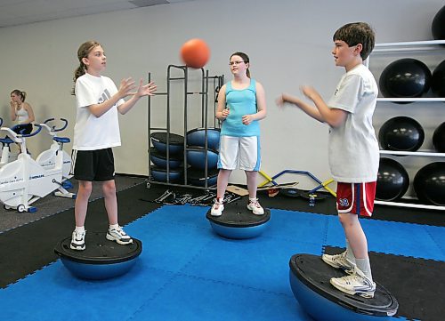 BORIS MINKEVICH / WINNIPEG FREE PRESS  060516 Leah Kerger,11, Angela MacKenzie,12, and Ian MacKenzie,10 do some excercises in a fitness program.