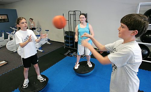 BORIS MINKEVICH / WINNIPEG FREE PRESS  060516 Leah Kerger,11, Angela MacKenzie,12, and Ian MacKenzie,10 do some excercises in a fitness program.